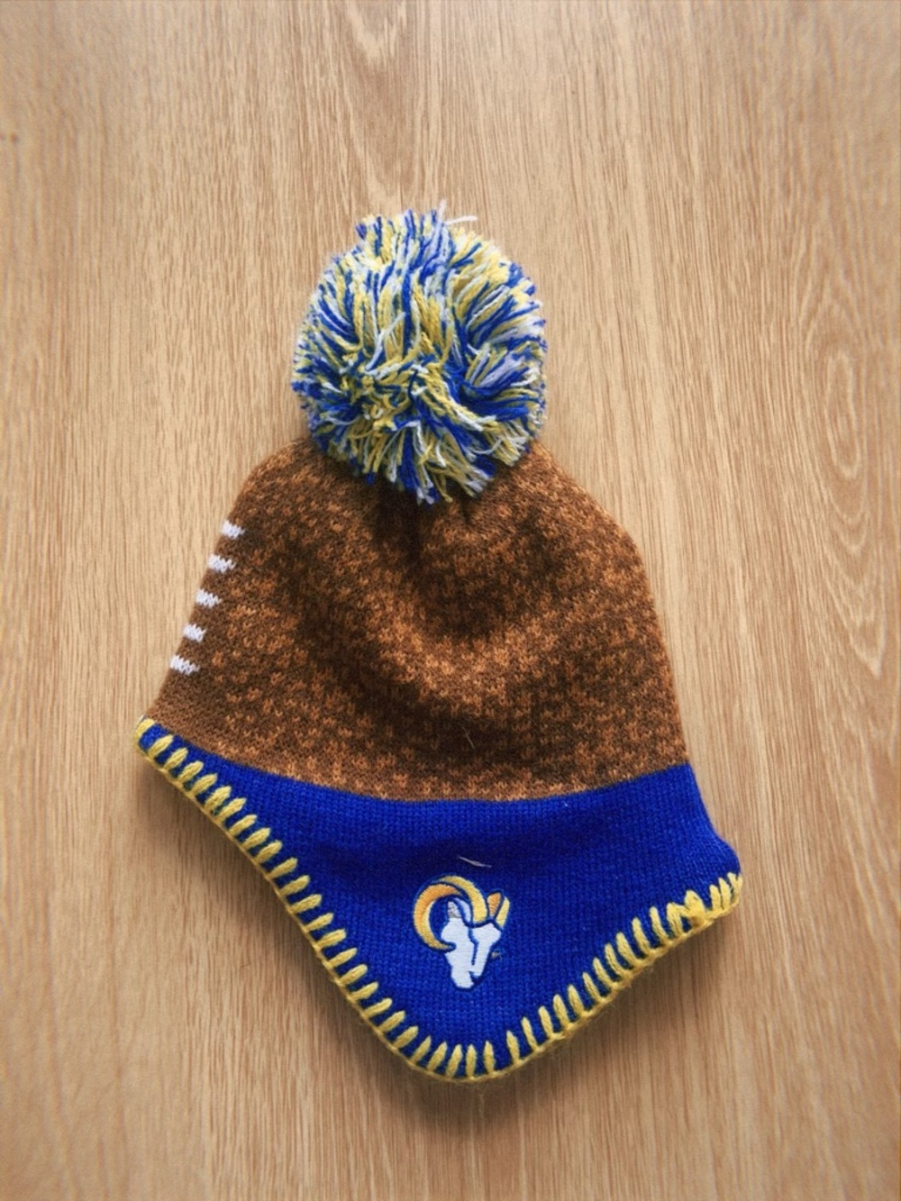 NFL Rams Infant Pom Pom Beanie Hat in Brown, Royal Blue, Yellow